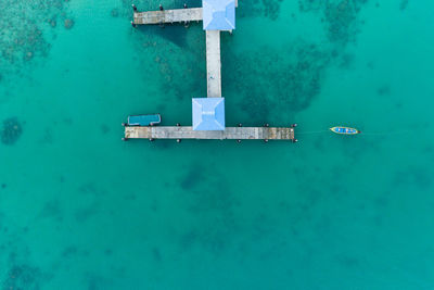Directly above shot of built structures on pier in sea