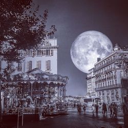 Group of people in front of building at night