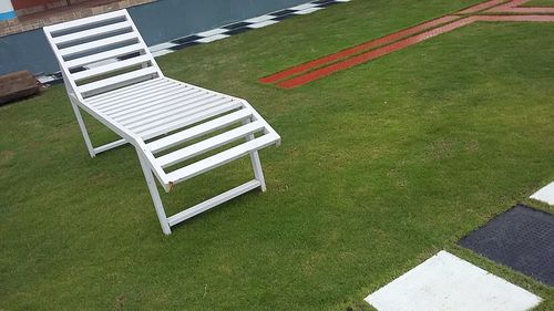 Empty bench in lawn