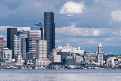 Modern buildings in city against sky