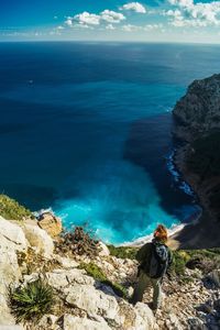 High angle view of rocks in sea against sky