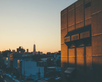 Modern buildings in city at sunset