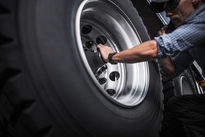 Mechanic working on car at workshop