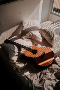 High angle view of guitar at home