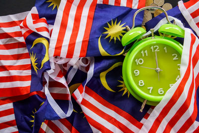 Green clock on malaysia flags