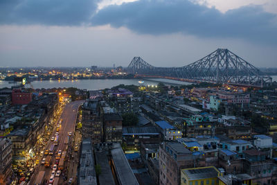 High angle view of illuminated city buildings at night