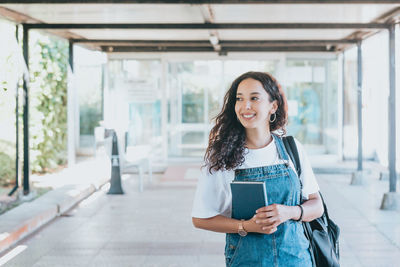 Young woman standing in city