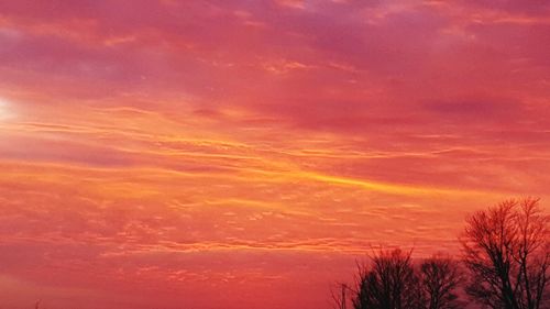 Low angle view of dramatic sky at sunset