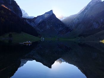 Reflection of mountains in lake against sky