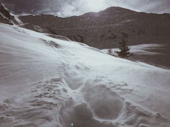 Scenic view of mountains against sky during winter