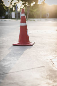 Red umbrella on road in city