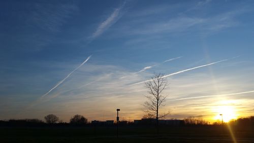 Scenic view of landscape against sky at sunset