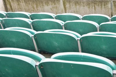 Full frame shot of empty chairs in grass