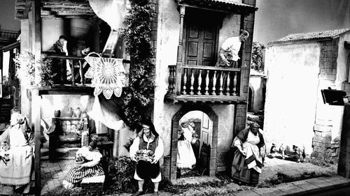 Group of people in front of buildings