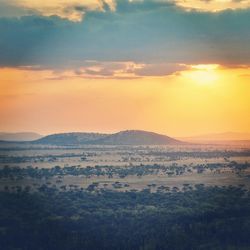 Scenic view of landscape against sky during sunset