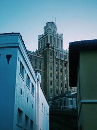 Low angle view of buildings against blue sky