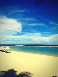 Scenic view of sea against cloudy sky