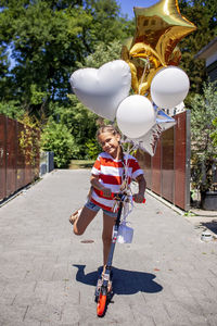 Rear view of people walking on street