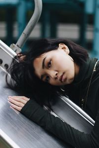 Portrait of young woman in car