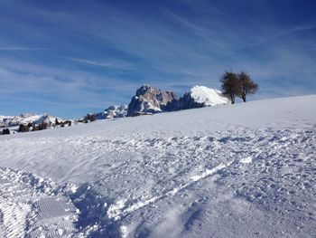 Scenic view of snow covered mountain against sky