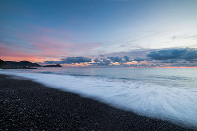 Scenic view of sea against sky during sunset