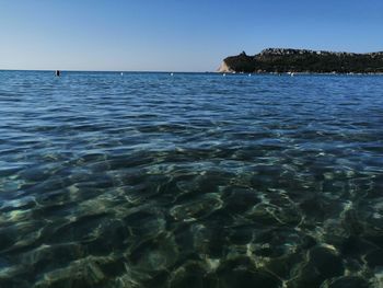 Scenic view of sea against clear blue sky