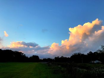Scenic view of field against sky during sunset