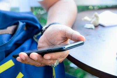 Close-up of man using mobile phone