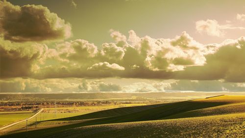 Scenic view of agricultural field against sky