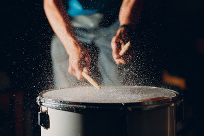 Close-up of man playing guitar