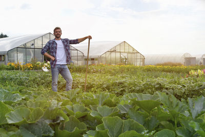 Farmer standing in vegetable field