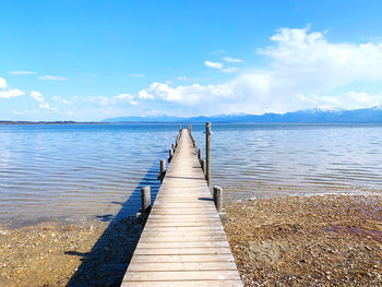 Pier over sea against sky