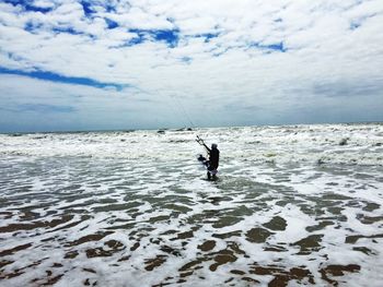 Scenic view of sea against cloudy sky