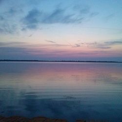 Scenic view of calm lake at sunset