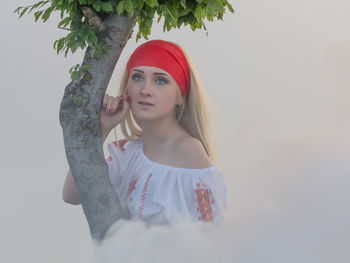 Portrait of a young woman looking away