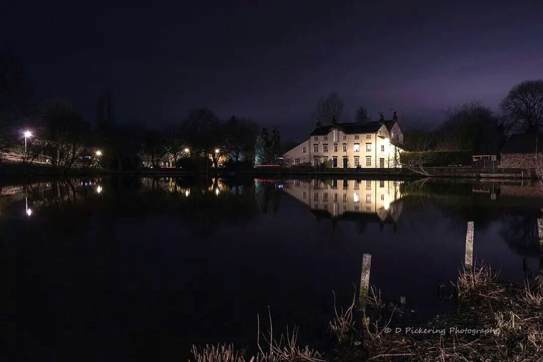 water, reflection, night, architecture, built structure, illuminated, building exterior, sky, lake, river, waterfront, tree, house, standing water, tranquility, scenics, tranquil scene, outdoors, nature, no people