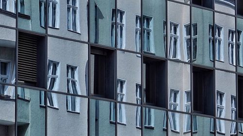 Low angle view of building with reflection