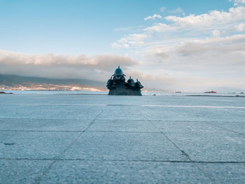 Scenic view of sea by building against sky