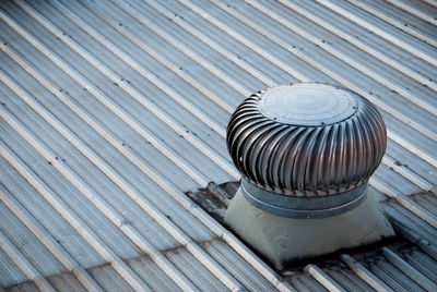 High angle view of metallic smoke stack on roof