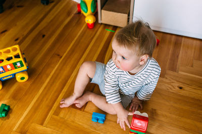 Cute little child is playing at home