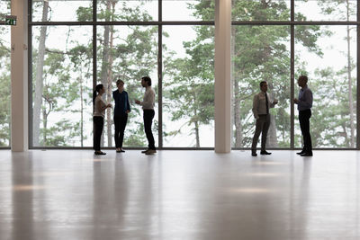 People standing in glass window