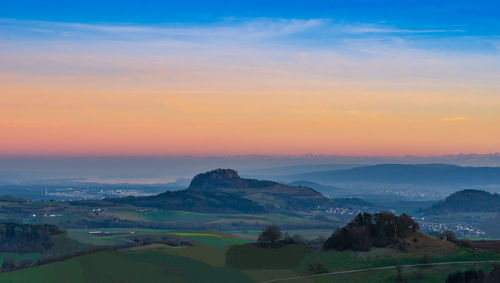 Scenic view of landscape against sky during sunset