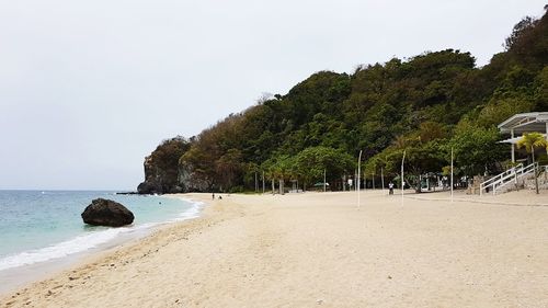 Scenic view of beach against clear sky