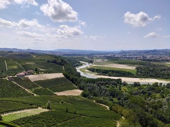 High angle view of agricultural fields against sky