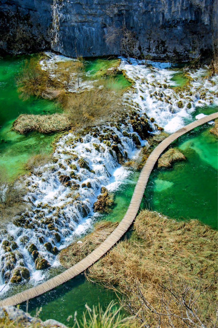 SCENIC VIEW OF RIVER FLOWING AMIDST ROCKS