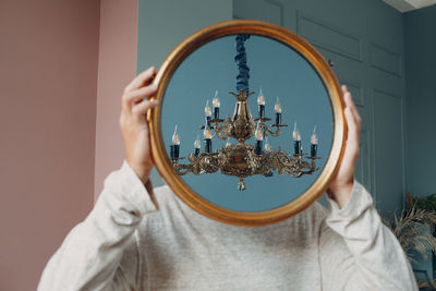 Portrait of man holding glass of building