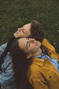 Rear view of couple kissing outdoors