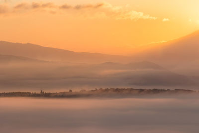 Scenic view of mountains against sky during sunset