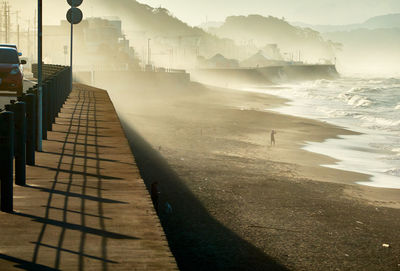 High angle view of footpath by sea against sky