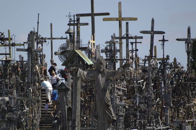 Panoramic shot of people working against sky